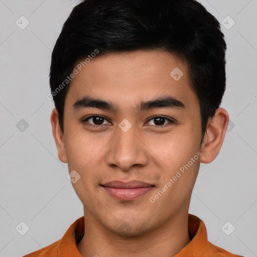 Joyful asian young-adult male with short  brown hair and brown eyes