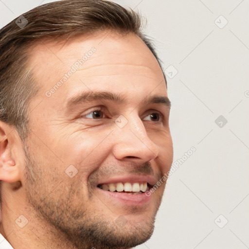 Joyful white adult male with short  brown hair and brown eyes