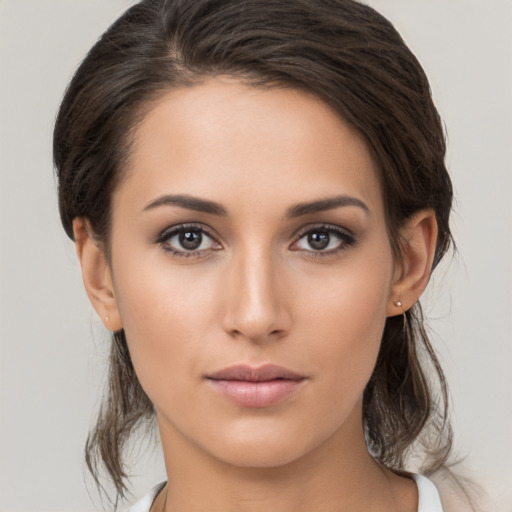 Neutral white young-adult female with medium  brown hair and brown eyes