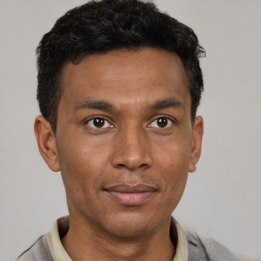Neutral latino young-adult male with short  brown hair and brown eyes