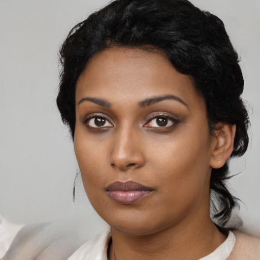 Neutral black young-adult female with medium  black hair and brown eyes