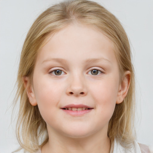 Joyful white child female with medium  brown hair and blue eyes