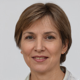 Joyful white adult female with medium  brown hair and brown eyes