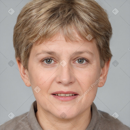 Joyful white adult female with short  brown hair and grey eyes