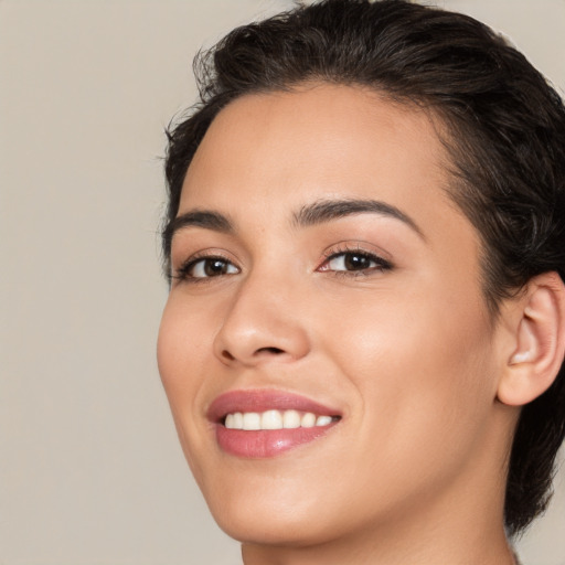 Joyful white young-adult female with medium  brown hair and brown eyes