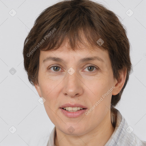 Joyful white adult female with short  brown hair and brown eyes