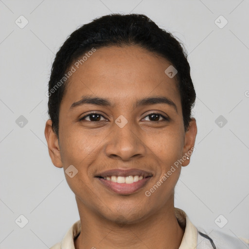 Joyful latino young-adult male with short  black hair and brown eyes