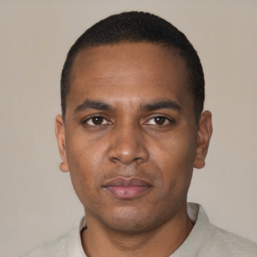 Neutral black young-adult male with short  black hair and brown eyes