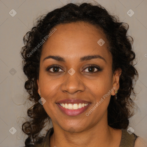 Joyful black young-adult female with long  brown hair and brown eyes