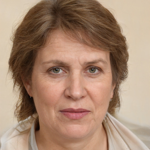 Joyful white adult female with medium  brown hair and brown eyes