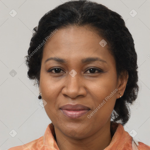 Joyful black adult female with medium  brown hair and brown eyes