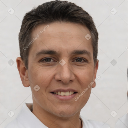 Joyful white adult male with short  brown hair and brown eyes