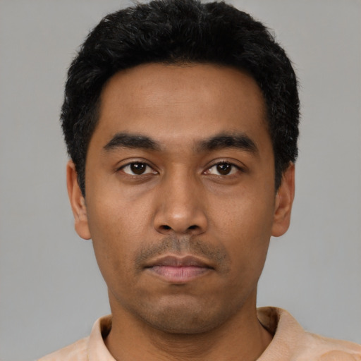 Neutral latino young-adult male with short  black hair and brown eyes