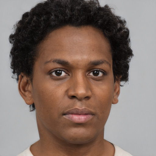 Neutral black young-adult female with short  brown hair and brown eyes