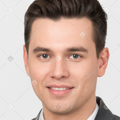 Joyful white young-adult male with short  brown hair and brown eyes