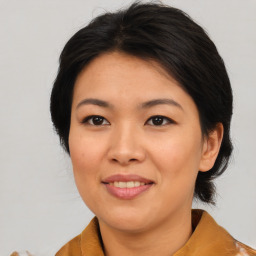 Joyful asian young-adult female with medium  brown hair and brown eyes