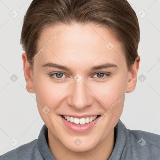 Joyful white young-adult female with short  brown hair and grey eyes