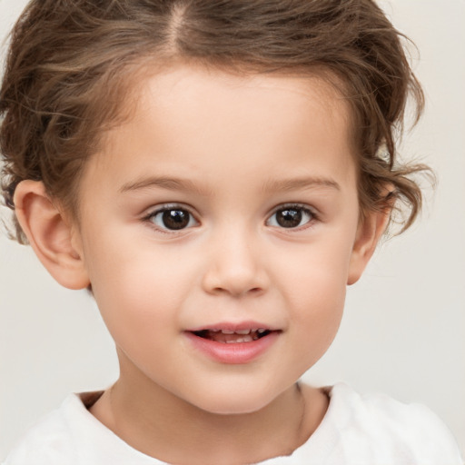 Joyful white child female with short  brown hair and brown eyes