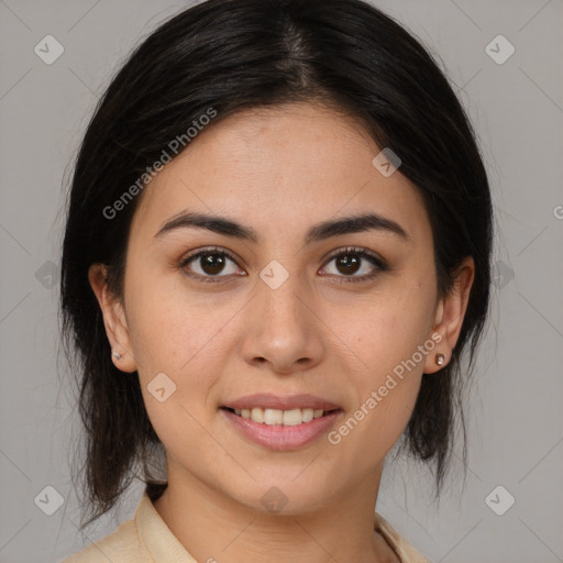 Joyful latino young-adult female with medium  brown hair and brown eyes