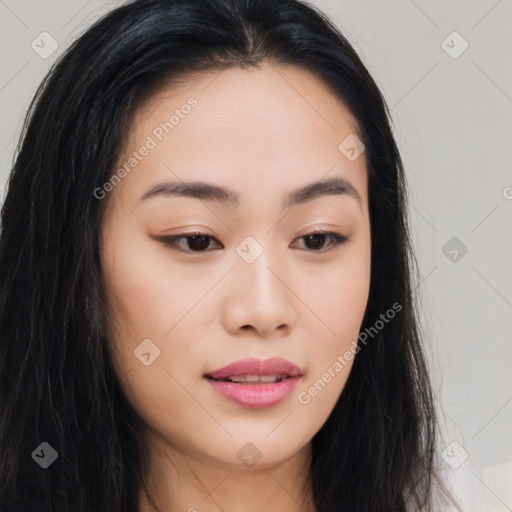 Joyful asian young-adult female with long  brown hair and brown eyes