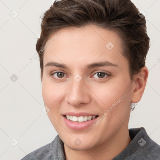 Joyful white young-adult female with short  brown hair and brown eyes