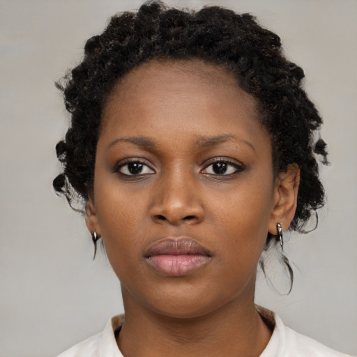 Neutral black young-adult female with short  brown hair and brown eyes