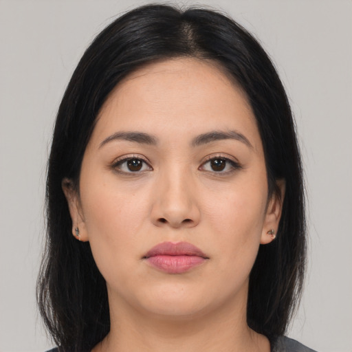 Neutral latino young-adult female with long  black hair and brown eyes