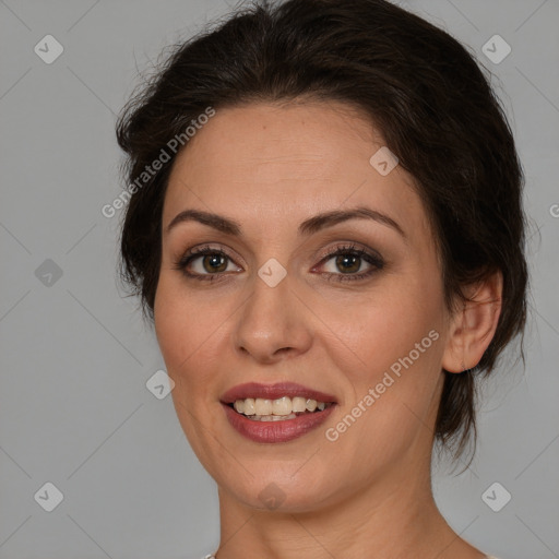 Joyful white adult female with medium  brown hair and brown eyes