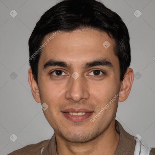 Joyful white young-adult male with short  black hair and brown eyes