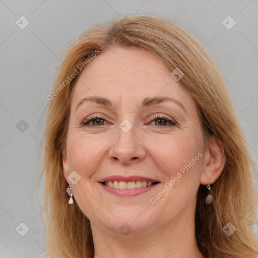 Joyful white adult female with long  brown hair and brown eyes