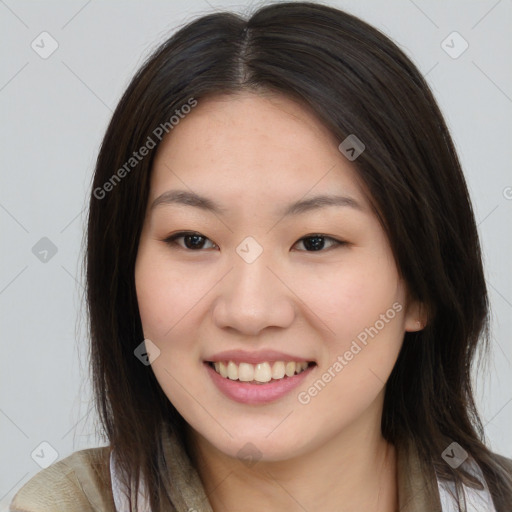 Joyful asian young-adult female with long  brown hair and brown eyes