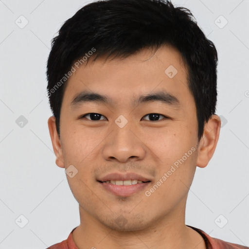 Joyful asian young-adult male with short  black hair and brown eyes