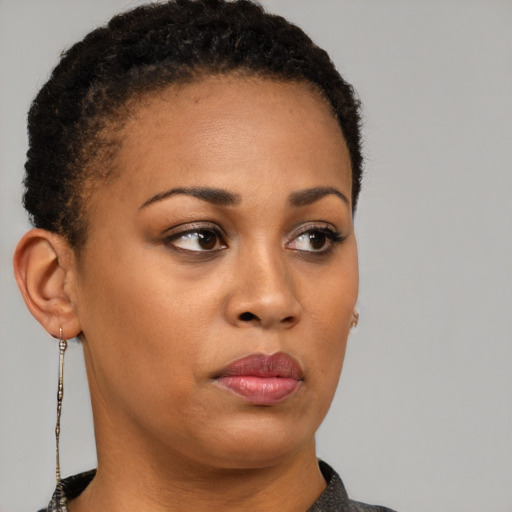 Neutral black young-adult female with short  brown hair and brown eyes
