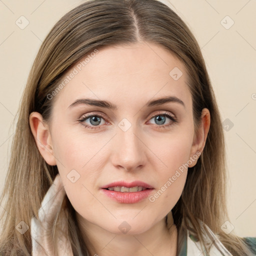 Joyful white young-adult female with long  brown hair and blue eyes