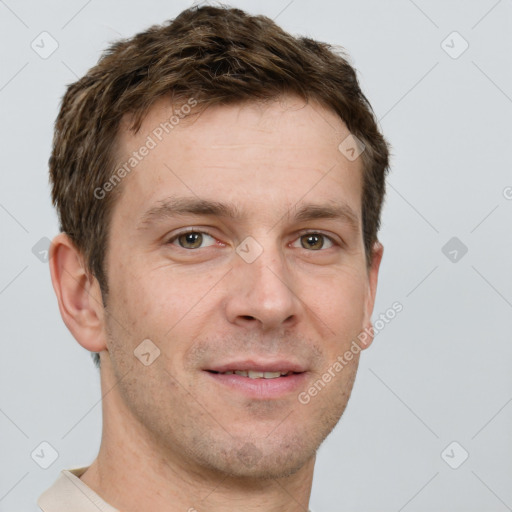 Joyful white adult male with short  brown hair and grey eyes