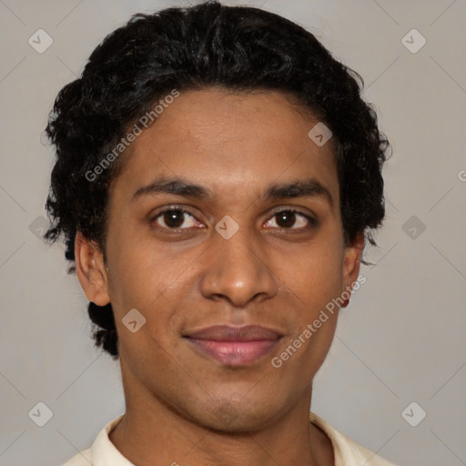 Joyful latino young-adult male with short  brown hair and brown eyes