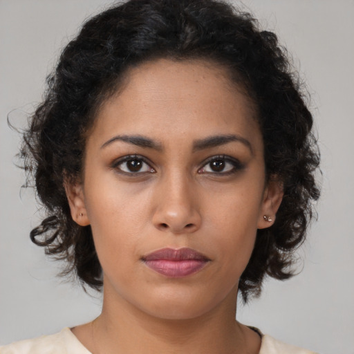 Neutral latino young-adult female with medium  brown hair and brown eyes