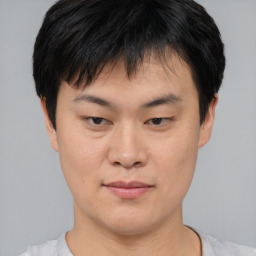 Neutral asian young-adult male with short  black hair and brown eyes