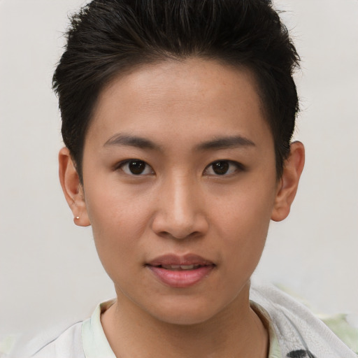 Joyful asian young-adult female with short  brown hair and brown eyes