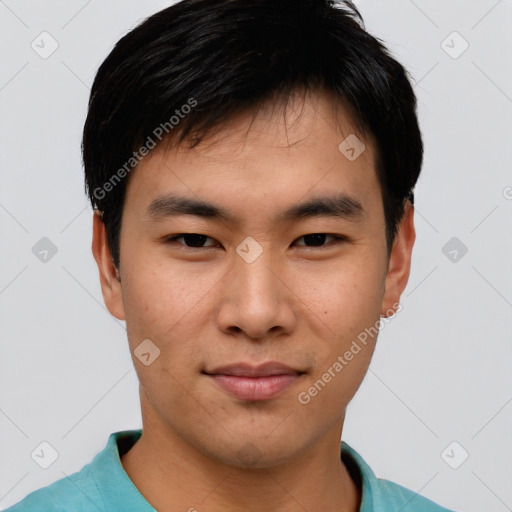 Joyful asian young-adult male with short  black hair and brown eyes