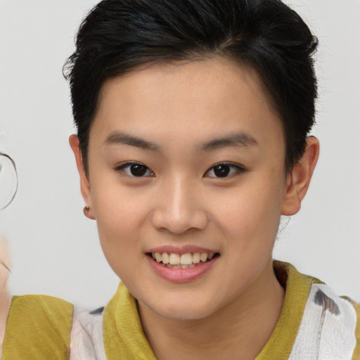Joyful asian young-adult female with short  brown hair and brown eyes