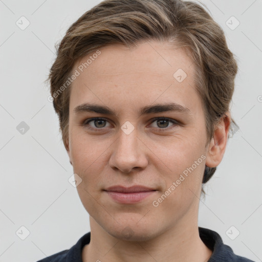 Joyful white young-adult female with short  brown hair and grey eyes