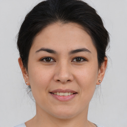 Joyful asian young-adult female with medium  brown hair and brown eyes