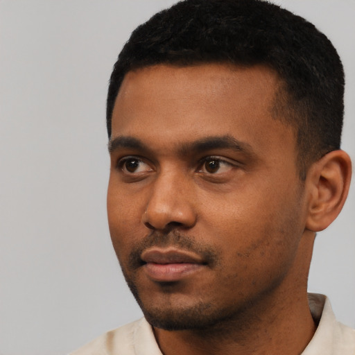 Neutral black young-adult male with short  black hair and brown eyes