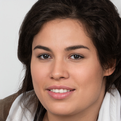 Joyful white young-adult female with medium  brown hair and brown eyes