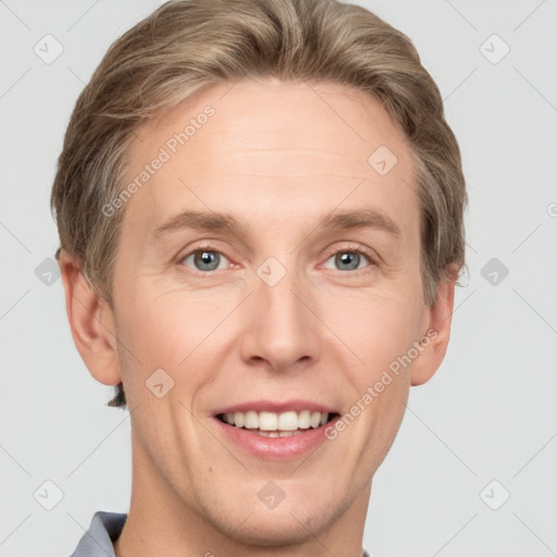 Joyful white adult male with short  brown hair and grey eyes