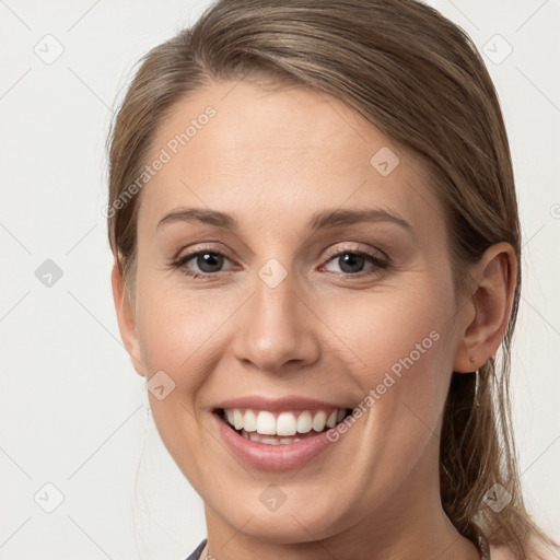 Joyful white young-adult female with medium  brown hair and grey eyes