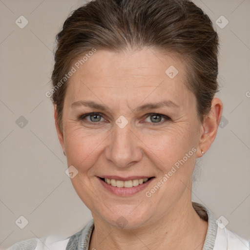 Joyful white adult female with short  brown hair and brown eyes