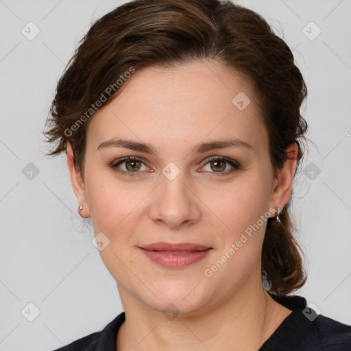 Joyful white young-adult female with medium  brown hair and green eyes