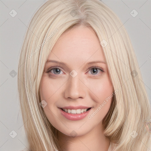 Joyful white young-adult female with long  brown hair and blue eyes